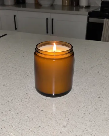 The phone photo it started from: a candle on a kitchen counter